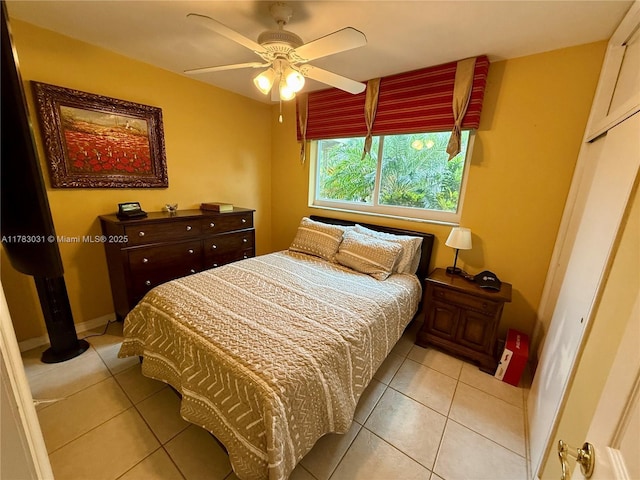 bedroom with light tile patterned floors and ceiling fan