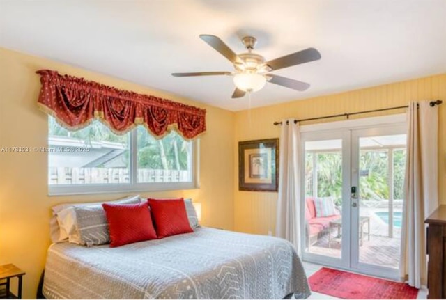 bedroom with french doors, access to outside, and a ceiling fan