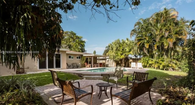 pool featuring a patio area