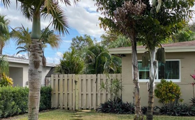 view of property exterior featuring fence
