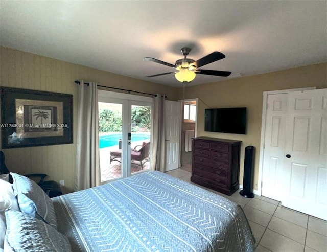 bedroom featuring french doors, tile patterned floors, access to outside, and ceiling fan