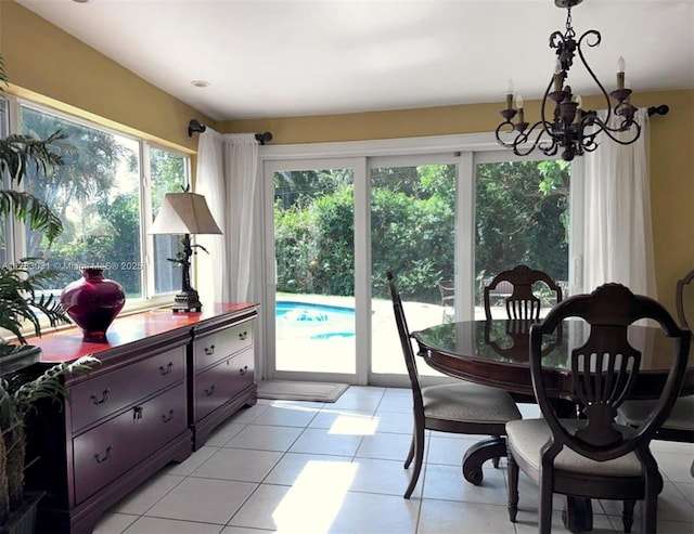 dining area featuring a chandelier and light tile patterned floors