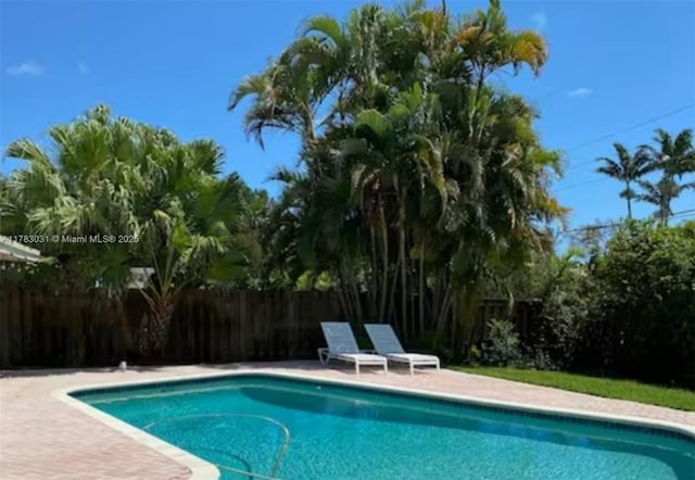 view of pool with fence and a fenced in pool