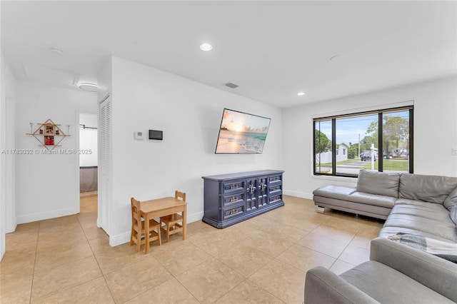living area with recessed lighting, baseboards, visible vents, and light tile patterned floors