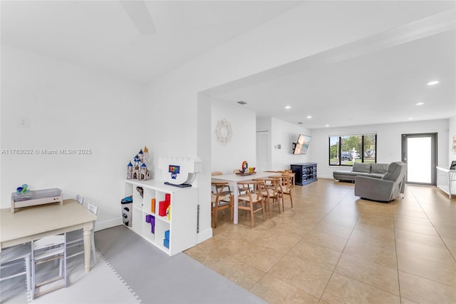 dining area featuring baseboards, recessed lighting, and light tile patterned floors