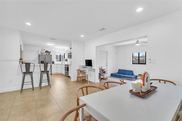 dining room with a ceiling fan, visible vents, and recessed lighting