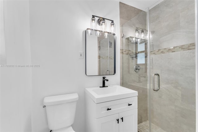 full bath with a shower stall, toilet, and vanity