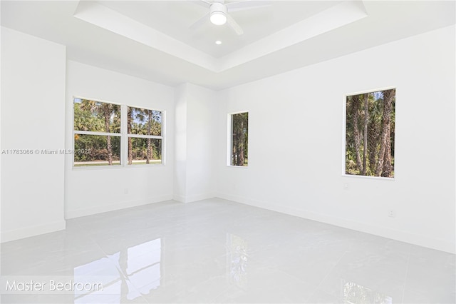 3802 30th Ave SE, Naples, FL 34117 - spare room with a raised ceiling, baseboards, ceiling fan, and recessed lighting