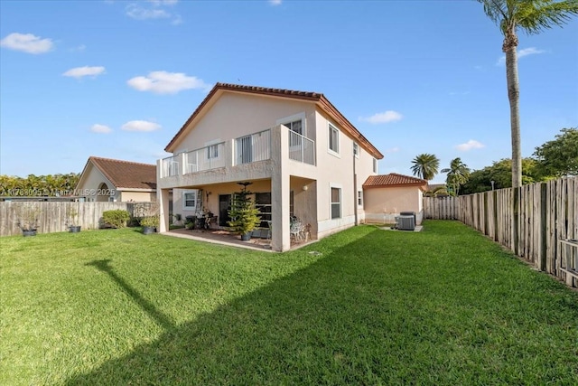 15489 SW 150th St, Miami, FL 33196 - rear view of property with stucco siding, central AC unit, a fenced backyard, and a tile roof
