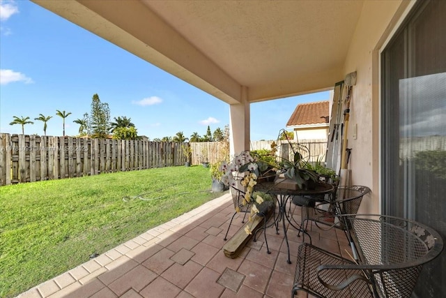 15489 SW 150th St, Miami, FL 33196 - view of patio with outdoor dining space and a fenced backyard