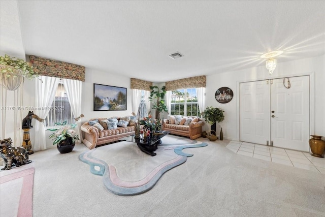 15489 SW 150th St, Miami, FL 33196 - living area featuring visible vents, carpet flooring, and tile patterned flooring