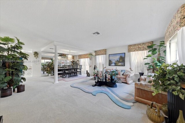 15489 SW 150th St, Miami, FL 33196 - living area featuring carpet, visible vents, and decorative columns