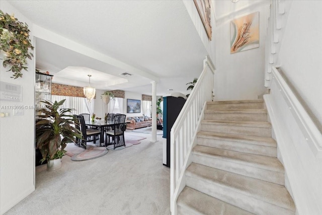 15489 SW 150th St, Miami, FL 33196 - stairway featuring visible vents, a notable chandelier, and carpet floors