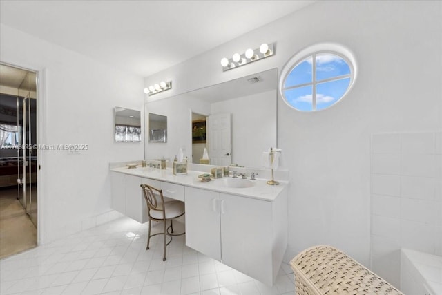 15489 SW 150th St, Miami, FL 33196 - full bath with visible vents, tile patterned flooring, double vanity, and a sink