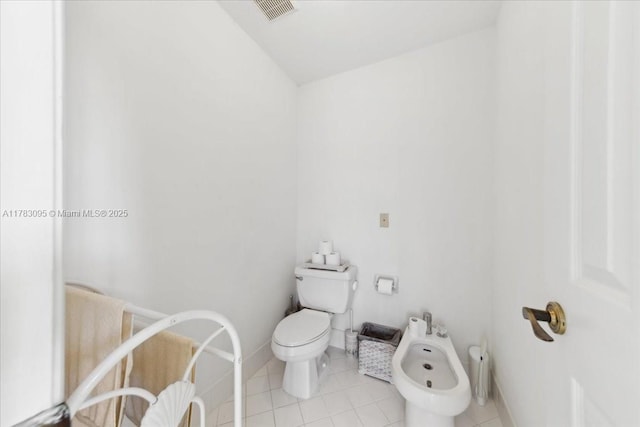 15489 SW 150th St, Miami, FL 33196 - half bath with visible vents, toilet, tile patterned flooring, and a bidet