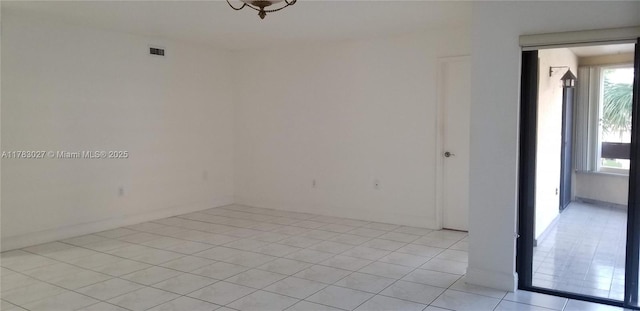 8850 SW 123rd Ct Unit H302, Miami, FL 33186 - spare room with visible vents, baseboards, and light tile patterned flooring