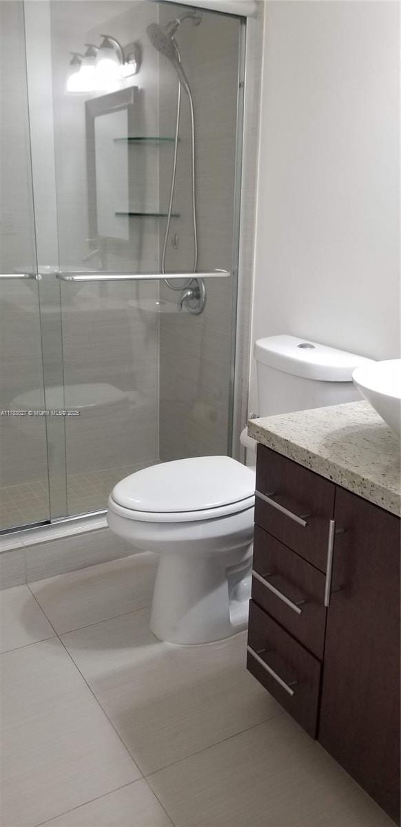 8850 SW 123rd Ct Unit H302, Miami, FL 33186 - full bathroom with toilet, vanity, a stall shower, and tile patterned flooring