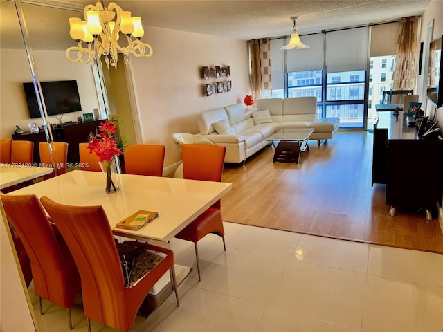 231 174th St Unit 2308, Sunny Isles Beach, FL 33160 - tiled living room with a chandelier, expansive windows, and a textured ceiling