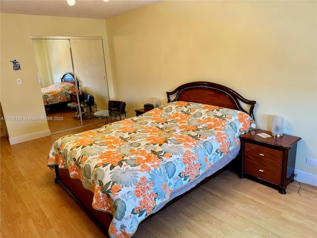 231 174th St Unit 2308, Sunny Isles Beach, FL 33160 - bedroom with wood finished floors, a closet, and baseboards