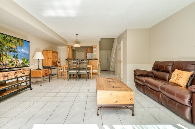 living area with light tile patterned floors