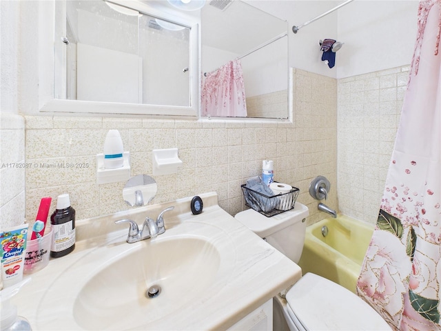 bathroom with shower / tub combo, vanity, and toilet