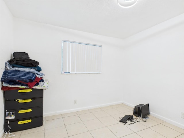 tiled spare room with baseboards