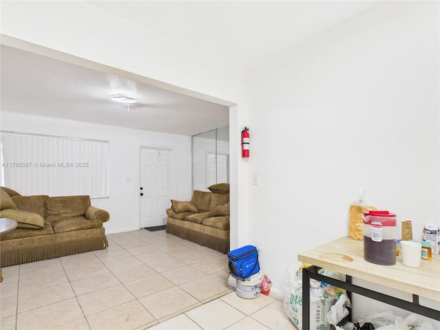 living room with light tile patterned flooring
