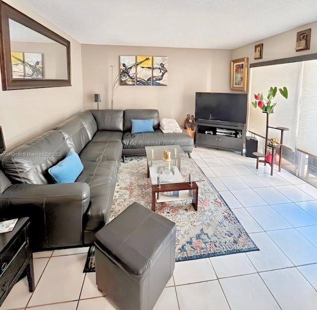 tiled living area featuring a textured ceiling
