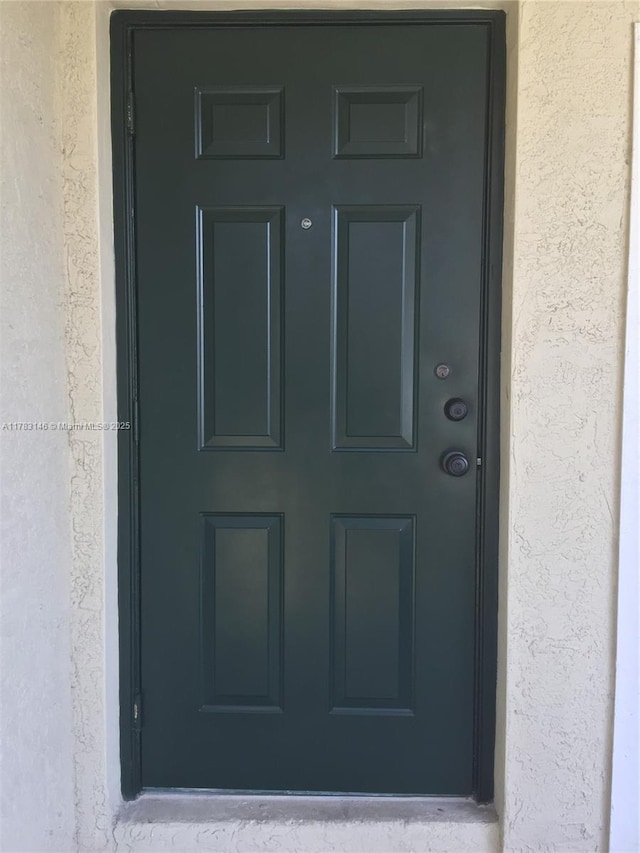 802 Belmont Ln Unit 802, North Lauderdale, FL 33068 - view of exterior entry featuring stucco siding