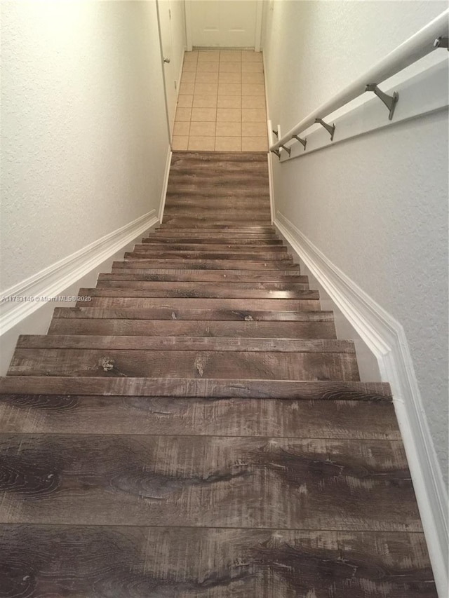 802 Belmont Ln Unit 802, North Lauderdale, FL 33068 - stairs with a textured wall and tile patterned floors
