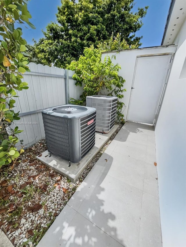 exterior view of central air condition unit and fence