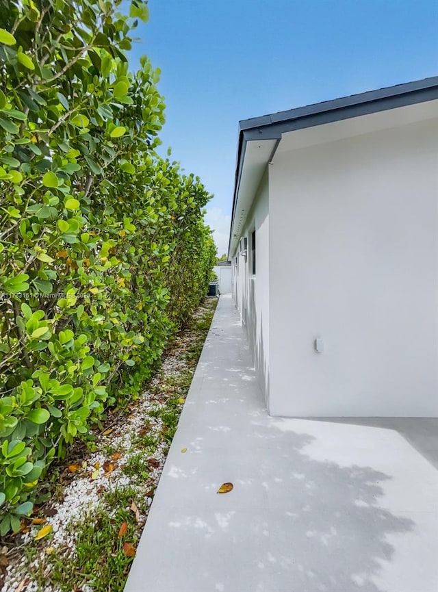 view of side of property with stucco siding
