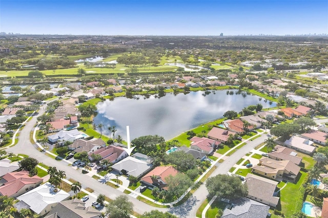 birds eye view of property featuring a water view and a residential view