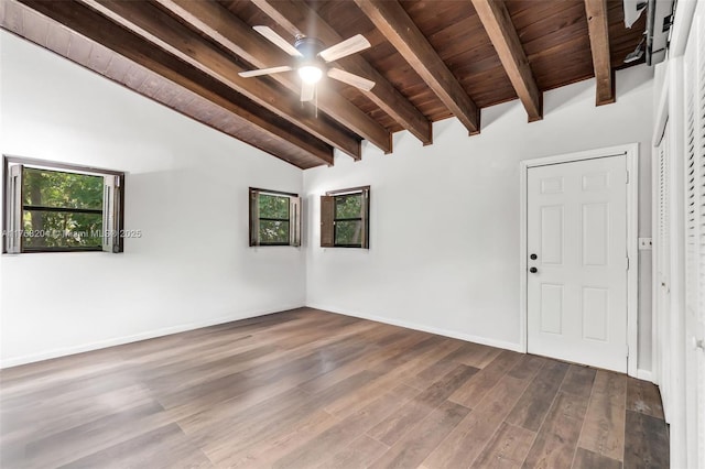 unfurnished room with ceiling fan, wooden ceiling, vaulted ceiling with beams, baseboards, and dark wood-style floors