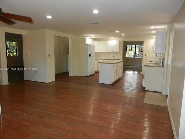18950 SW 240th St, Homestead, FL 33031 - kitchen with white appliances, a kitchen island, white cabinetry, dark wood-style floors, and recessed lighting