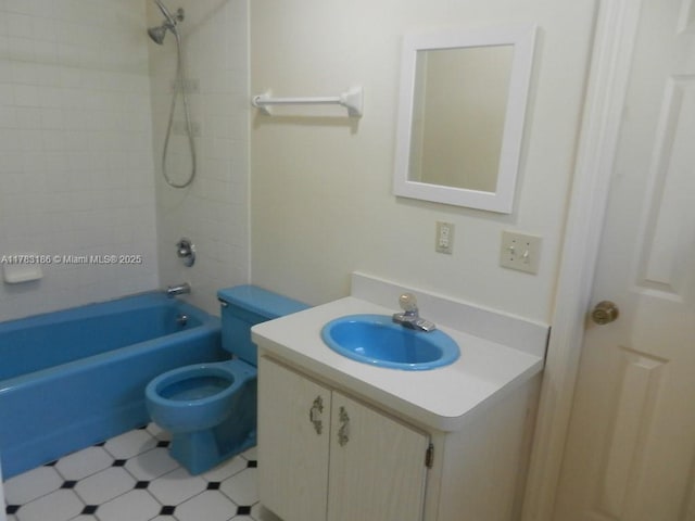 bathroom featuring vanity,  shower combination, and toilet