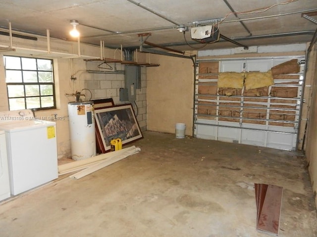 garage featuring a garage door opener, washer and clothes dryer, and electric water heater