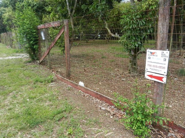 view of gate with fence