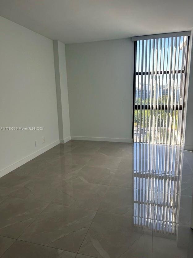 20301 W Country Club Dr Unit 830, Aventura, FL 33180 - empty room featuring baseboards