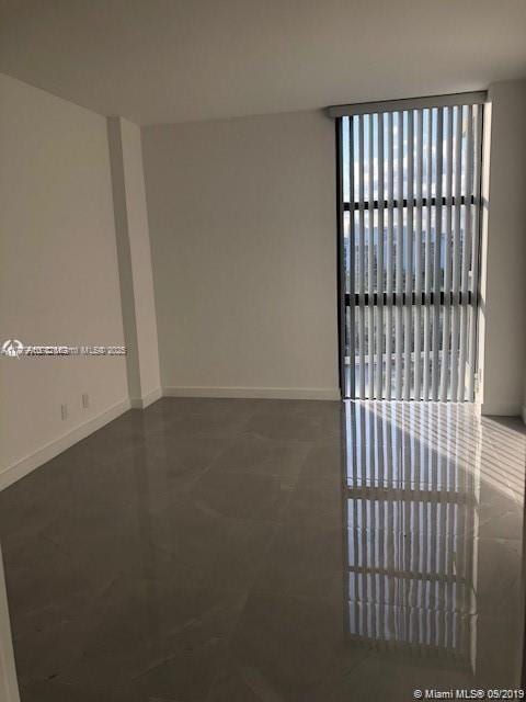 20301 W Country Club Dr Unit 830, Aventura, FL 33180 - empty room featuring baseboards
