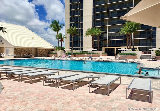 20301 W Country Club Dr Unit 830, Aventura, FL 33180 - community pool featuring a patio area