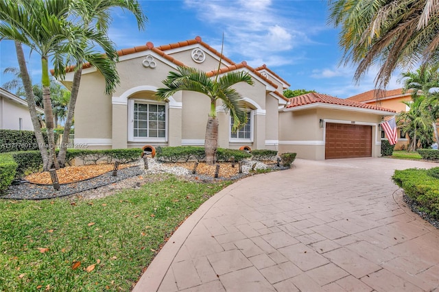 4060 SW 152nd Ave, Miramar, FL 33027 - mediterranean / spanish home with a tiled roof, a garage, stucco siding, and driveway