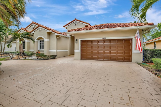 4060 SW 152nd Ave, Miramar, FL 33027 - mediterranean / spanish-style house featuring a tiled roof, driveway, stucco siding, and a garage
