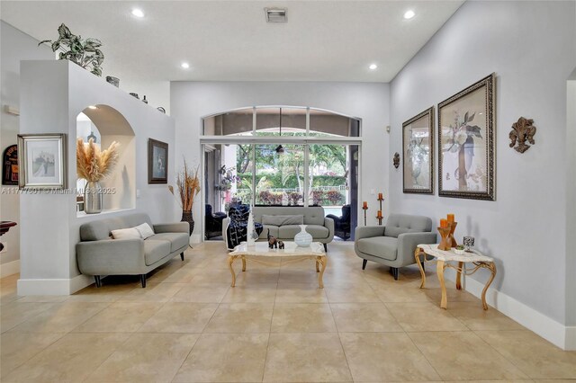 4060 SW 152nd Ave, Miramar, FL 33027 - living room with arched walkways, light tile patterned flooring, visible vents, and recessed lighting