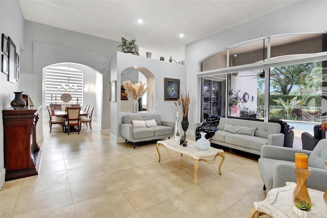4060 SW 152nd Ave, Miramar, FL 33027 - living room featuring light tile patterned floors, recessed lighting, arched walkways, and a healthy amount of sunlight