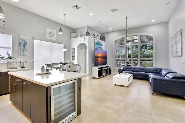 4060 SW 152nd Ave, Miramar, FL 33027 - kitchen with wine cooler, visible vents, open floor plan, and light countertops