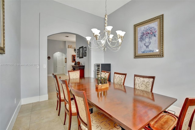 4060 SW 152nd Ave, Miramar, FL 33027 - dining area featuring arched walkways, light tile patterned floors, baseboards, and a notable chandelier