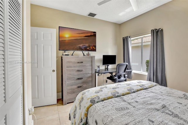 4060 SW 152nd Ave, Miramar, FL 33027 - bedroom with a textured ceiling, light tile patterned floors, a ceiling fan, and visible vents