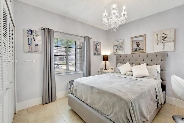 4060 SW 152nd Ave, Miramar, FL 33027 - bedroom featuring light tile patterned floors, baseboards, and a notable chandelier