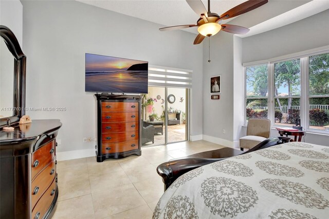 4060 SW 152nd Ave, Miramar, FL 33027 - bedroom with baseboards, a ceiling fan, a high ceiling, and light tile patterned flooring